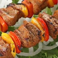 Lamb Shish Kebab · Char-grilled chunks of tender baby lamb, onions and green peppers, served with rice and. (Se...