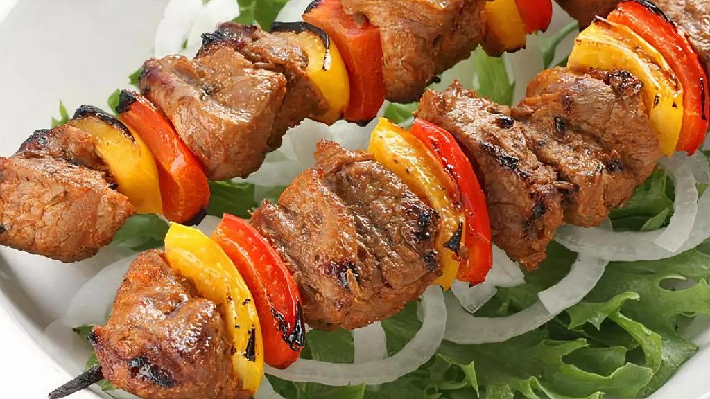 Lamb Shish Kebab · Char-grilled chunks of tender baby lamb, onions and green peppers, served with rice and. (Served in 6pc)