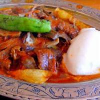 Iskender Kebab · Thin sliced lamb (if lamb gyro is out, will replace with lamb adana meat), served over Turki...