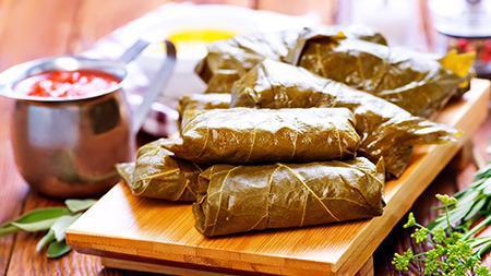 Salmon In Vine Leaves · Marinated chunks of salmon wrapped in grape leaves, char-grilled. (5pc)