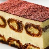 Tiramisu · Layers of sponge cake soaked in espresso and mascarpone cream dusted with cocoa.