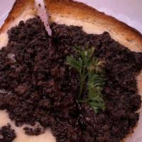 Tartufata Open-Faced Sandwich · Finely chopped champignons in truffle oil over fontina cheese.