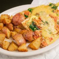 Breakfast Flatbread All Day Breakfast · Grilled flatbread topped with roma tomatoes, spinach, bacon scrambled into two eggs then dri...