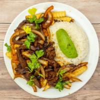 Lomo Saltado · Steak stir-fried with onion, tomato, cilantro, and soya sauce. Served with rice and French f...