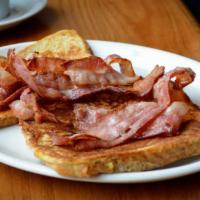 Bacon French Toast · 3 slices of challah bread soaked in eggs and milk, then fried and topped with crispy bacon s...