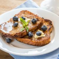 Blueberry French Toast · 3 slices of challah bread soaked in eggs and milk, then fried and topped with blueberries se...