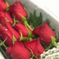 Dozen Roses Boxed · A dozen premium long stemmed roses boxed with baker fern and babies breath wrapped beautiful...