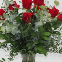 Dozen Red Roses In A Vase · Our Classic Dozen Red Roses in a Vase with mixed upscale greenery. If you'd like a different...