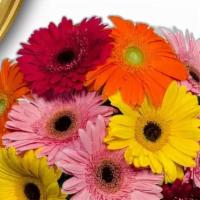 Gerbera Daisy Celebration · Assortment of Pink, Purple, and light pink flowers in a bouquet.