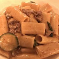 Rigatoni Da Giorgio · Rags of filet mignon, zucchini, cognac cream demiglaze.