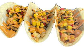 Taco · Grilled Cauliflower tacos topped with our home made mango salsa and chipotle sauce.