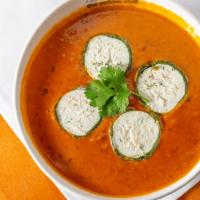 Shaam Savera · Spinach dumplings filled with creamy cottage cheese on a bed of velvety tomato gravy