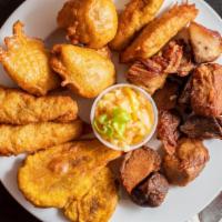 Griot/Fried Pork Meal  Medium · Savory tender pork  seasoned to perfection and deep fried.  Piklez included.