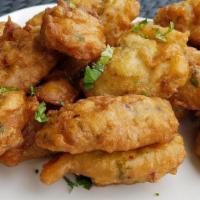 Marinade/Fritters · Fried dough prepared with herbs and spices, fried to golden perfection.
