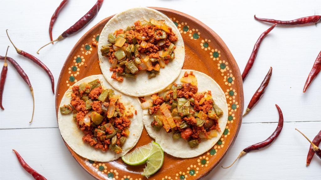 Chorizo Tacos · Fresh Chorizo (Spicy Pork Meat) Tacos made with fresh pico de gallo and combined with delicious homemade sauces (green & red spicy sauce).
