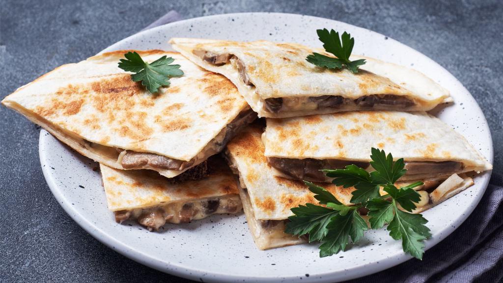 Steak Quesadilla · Fresh Quesadilla made with Grilled prime roast beef, cheddar cheese, jack cheese, salsa, and sour cream.