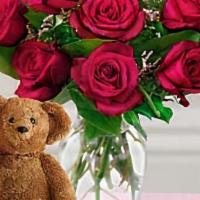 Dozen Roses With A Bear · 12 roses in a glass vase arrive with a soft plush teddy bear. Bear size and color may vary. ...