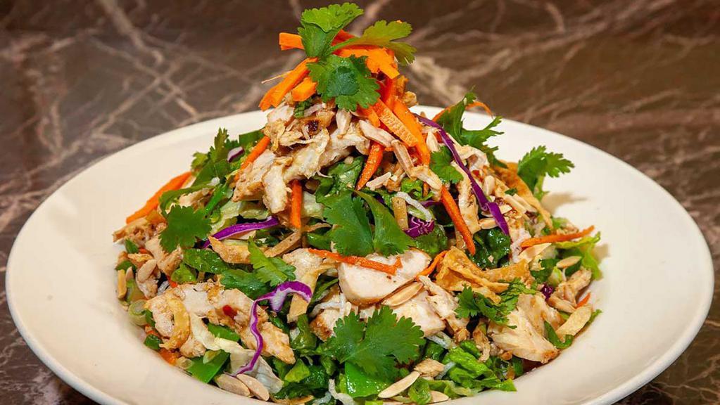 Lunch Special Asian Chicken Salad · Chicken, Crisp Wontons, Rice Noodles, Lettuce, Napa Cabbage, Edamame, Sugar Snap Peas, Carrots, Green Onion, Almonds and Cilantro. Tossed in Our Asian Dressing
