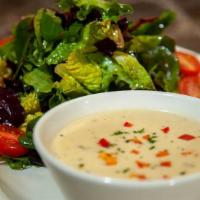 Soup And Salad · A Cup of Our Soup of the Day and a Mixed Green Salad.