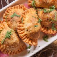 Empanadas · Flaky Pastry Filled with Beef, Chorizo, Peppers, Onions, Herbs and Spices