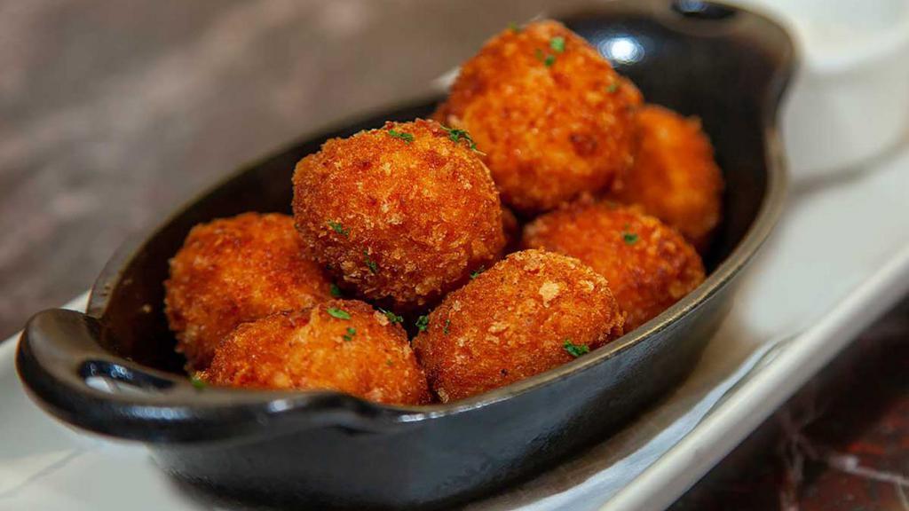 Buffalo Chicken Bites™ · Chicken Breast, Cheese and Our Spicy Buffalo Sauce, Fried Crisp with Blue Cheese Dressing