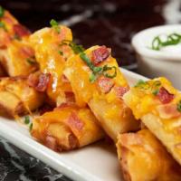 Double Stuffed Potato Spring Rolls® · Creamy Mashed Potatoes with a Touch of Green Onion, Rolled in Crispy Asian Wrappers Topped w...
