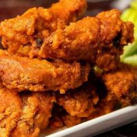 Buffalo Wings · Fried Wings Covered with Hot Sauce. Served with Blue Cheese Dressing and Celery Sticks