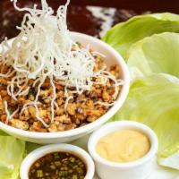 Chicken Lettuce Wraps · Minced Sauteed Chicken Breast and Vegetables in a Delicious Asian Sauce. Served with Cool Le...