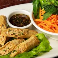 Crispy Thai Shrimp And Chicken Spring Rolls · Served with Thai Sweet-Hot Chili Sauce