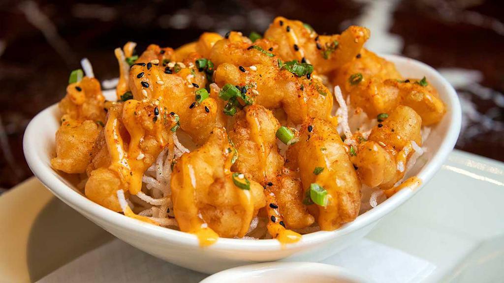 Volcano Shrimp · Light and Crispy Fried Shrimp Drizzled with a Spicy Chili Aioli
