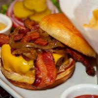 The Bacon-Cheese Burger · Topped with Crisp Applewood Smoked Bacon, Melted American Cheese, Grilled Onions and Thousan...