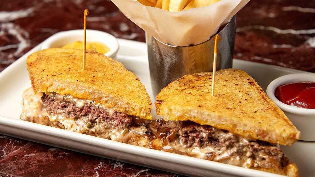 Grand Lux Burger Melt™ · Our Burger on Grilled Parmesan Cheese Bread with Lots of Cheddar Cheese, Grilled Onions and Thousand Island Dressing