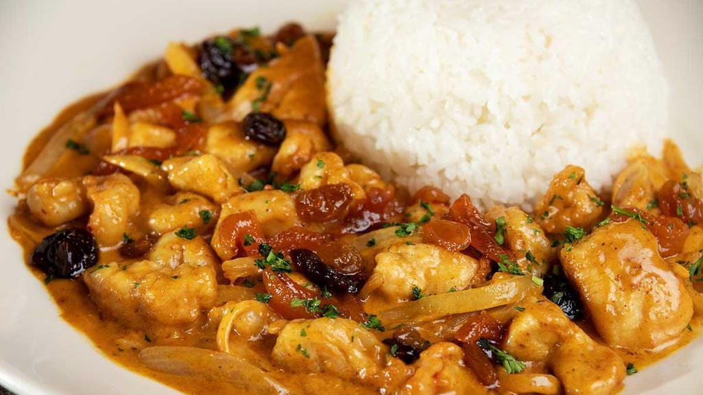 Indochine Shrimp And Chicken · A Fusion Dish of Chinese and Indian Flavors. Jumbo Shrimp, Chicken, Onions and Sweet Ginger all Sauteed in a Delicious Spicy Sauce of Curry, Plum Wine and a Little Cream Topped with Sun-Dried Cherries and Apricots. Served with Steamed Rice