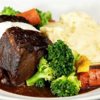 Braised Pot Roast · Cooked Low and Slow Until Perfectly Tender. Served with Mashed Potatoes, Vegetables and Hors...