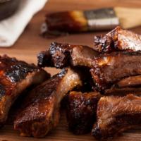 Bbq Baby Back Ribs (Half Rack) · Falling Off the Bone Tender! Wood Grilled Baby Back Ribs Glazed with Our B.B.Q. Sauce and Se...