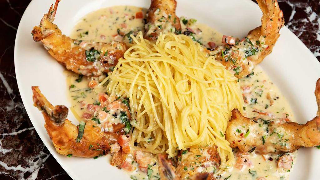 Shrimp Scampi · Sauteed with White Wine, Lemon, Garlic, Fresh Tomato, Basil, Parsley and a Touch of Cream. Served with Pasta