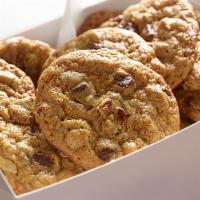 A Box Of Warm Homemade Chocolate Chip Pecan Cookies · A Freshly Baked Dozen