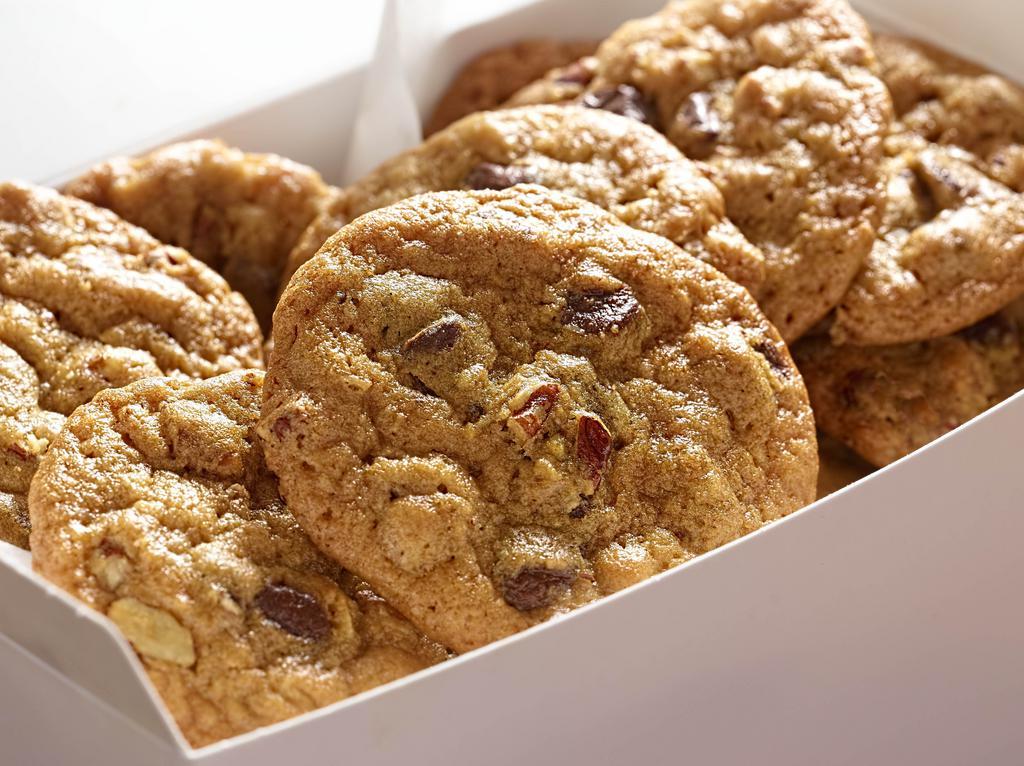 A Box Of Warm Homemade Chocolate Chip Pecan Cookies · A Freshly Baked Dozen