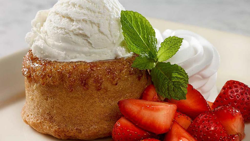 Warm Butter Cake · Warm Buttery Vanilla Cake with a Rich Creamy Center, Served with Fresh Strawberries and Vanilla Ice Cream