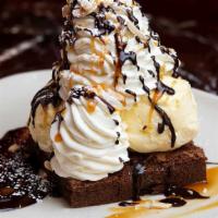 Warm Brownie Sundae · Our Housemade Brownie Topped with Vanilla Ice Cream, Whipped Cream, Toasted Almonds, Chocola...