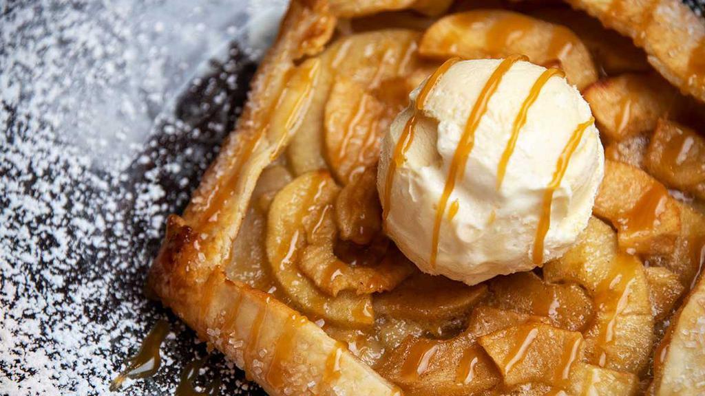 Warm Rustic Apple Pie · Baked when you order it! Flaky Sugared Crust Filled with Fresh Apples and Topped with Vanilla Ice Cream and Caramel