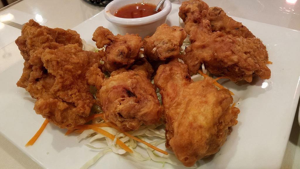 Fried Chicken · House marinated chicken, deep fried until crispy and golden brown served with our housemade sweet chili sauce.