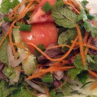 Thai Beef Salad · Grilled beef tossed with cucumber, carrot, onion, cilantro and a fresh tangy lemon juice dre...
