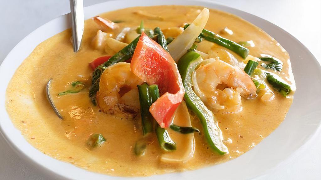 Panang Curry · Famous Bangkok peanut based curry. Prepared with red and green bell peppers, long bean, onion and fresh basil.