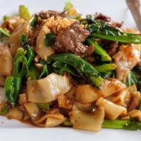 Pad Ki-Mao (Drunken Noodle) · Stir-fry chow fun noodles with Chinese broccoli, thai chillies and spices and fresh thai bas...