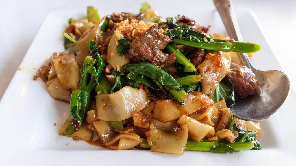 Pad Ki-Mao (Drunken Noodle) · Stir-fry chow fun noodles with Chinese broccoli, thai chillies and spices and fresh thai basils.