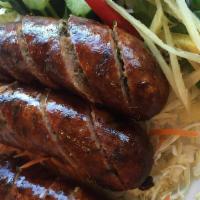 Sai Oua · Homemade pork sausage stuffed with traditional herbs and spices.