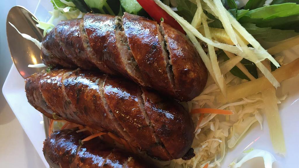Sai Oua · Homemade pork sausage stuffed with traditional herbs and spices.