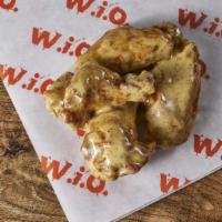 Wings - Classic (12) · Fresh, all-natural chicken wings, cooked crispy and tossed in your choice of flavor. Served ...