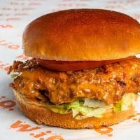 Buffalo Chicken Sandwich · Crispy buttermilk chicken tossed in mild buffalo sauce. Served with lettuce, tomato and blue...